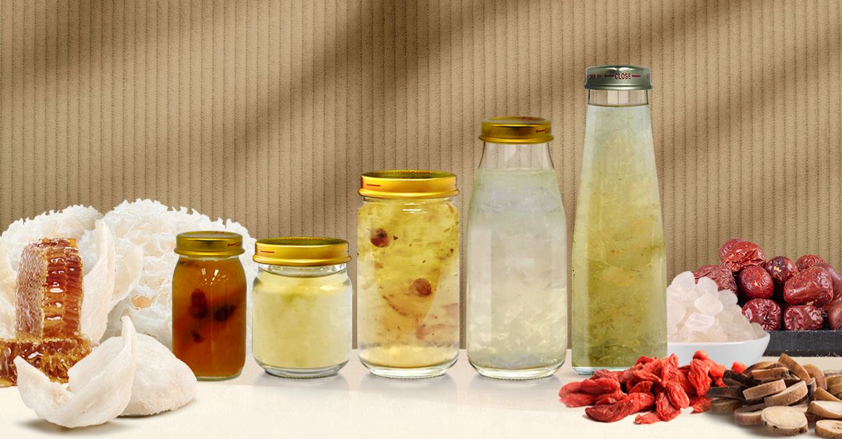 Wellness beverages in glass jars with bird’s nest, honeycomb, goji berries, and red dates.